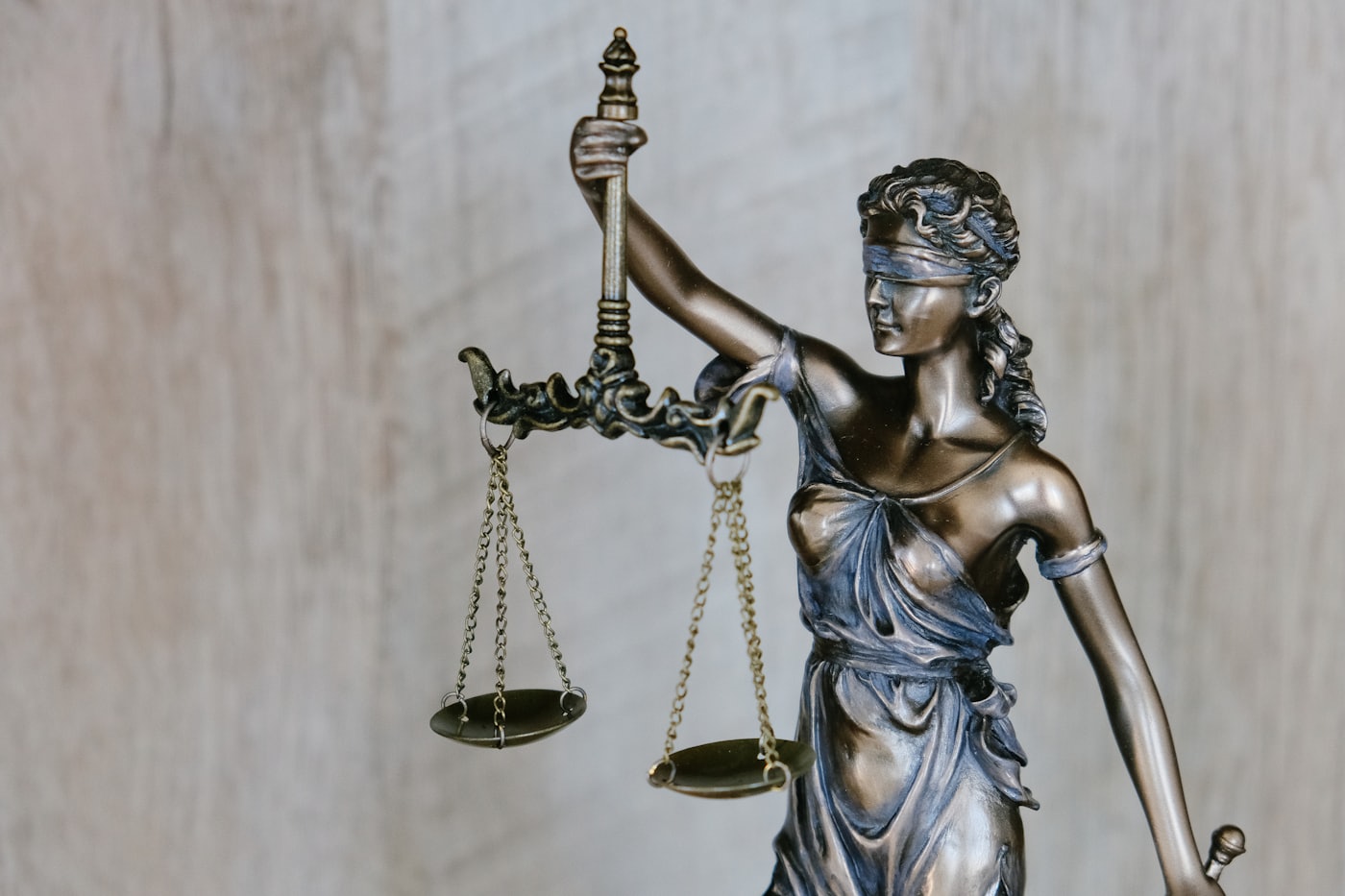 A judge's gavel resting on a wooden bench