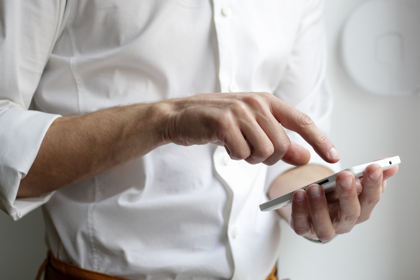 Anonymous hands operating a smartphone